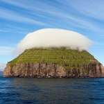 image for The tiny island of Lítla Dímun is often crowned with its own individual cloud.