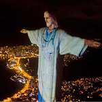 image for Rio's Christ the Redeemer statue was lit up to look like a doctor on Easter Sunday