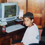 image for Me playing Age of Empires II on the family desktop with Cherry Coke at the ready, as always. Circa 2001.