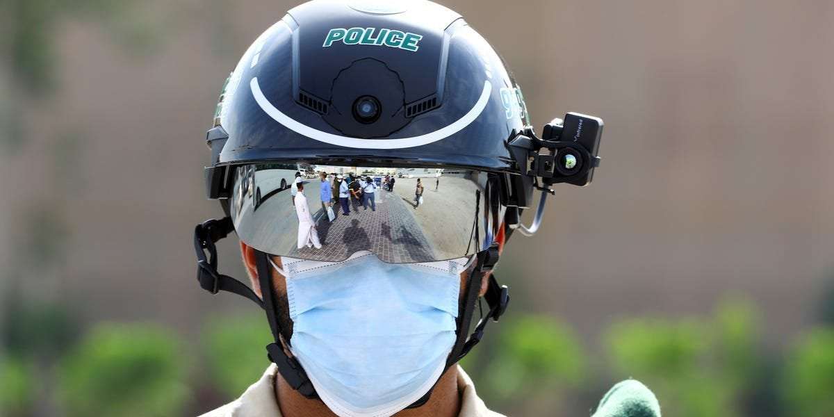 image for Police in China, Dubai, and Italy are using these surveillance helmets to scan people for COVID-19 fever as they walk past and it may be our future normal