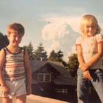 image for Two children posing as Mt St Helens erupted behind them. May 18 1980
