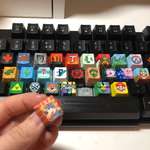 image for A month ago I started working on my husband’s birthday present - a custom painted keyboard filled with his favourite video games. The final one is just drying but it is DONE!