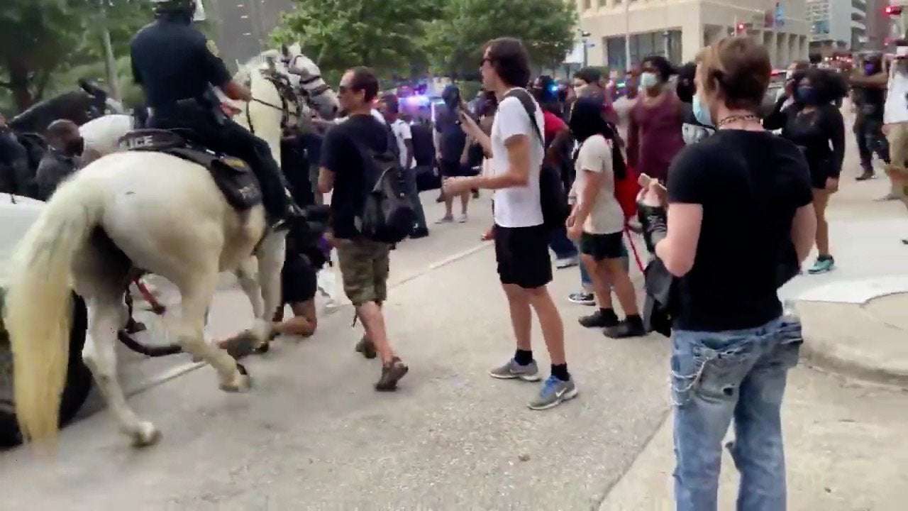 image for Police investigating after video shows mounted patrol officer trample protester in downtown Houston