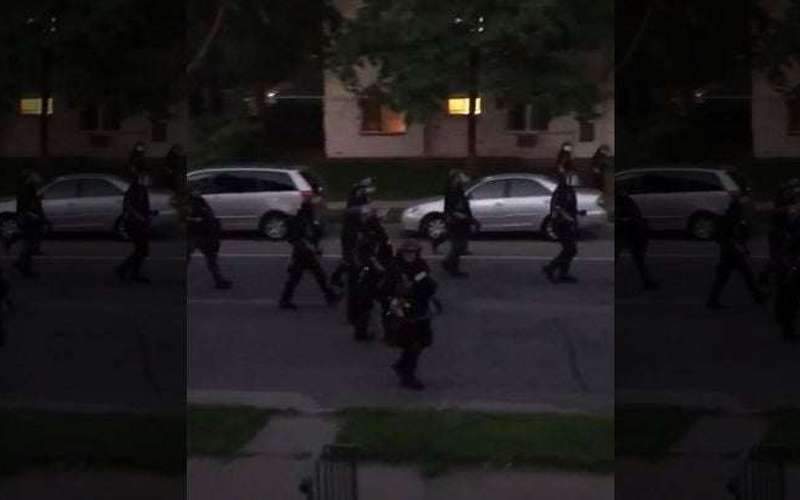 image for Video: Law enforcement fires paint projectile at residents on porch during curfew in Minneapolis