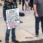 image for A veteran protesting his government after fighting for it shows the united fight for equality.