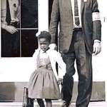 image for U.S. Marshalls escorting the extremely brave Ruby Bridges, 6 years old, to school in 1960. This Courageous young girl is known for being the first African American child to attend an all-white elementary school in the South.