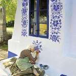 image for In her 90s, Czech woman Anežka Kašpárková passes time by painting on buildings in the village of Louka