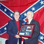 image for Senator Mitch McConnell, whose up for reelection, posing with the confederate flag