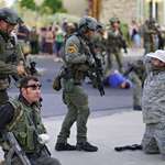 image for Police detain armed militia members after protestor is shot in Albuquerque, New Mexico