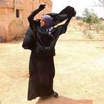 image for Liberation: A woman removes her niqab after her city is freed from Isis control