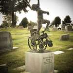 image for A father designs a headstone for his wheelchair-bound son depicting him "free of his earthly burdens."