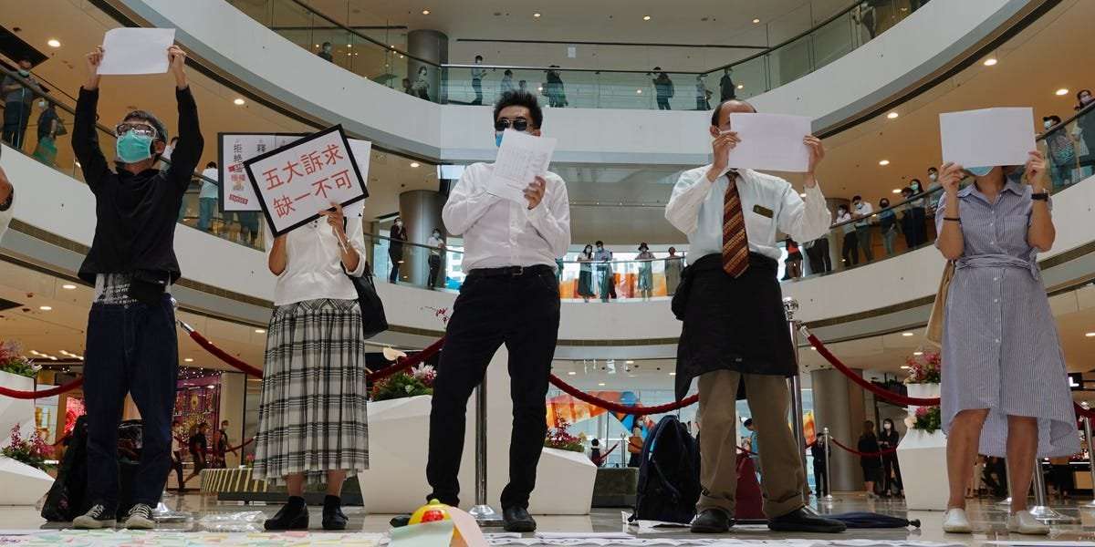 image for Hong Kong activists are holding up blank signs because China now has the power to define pro-democracy slogans as terrorism