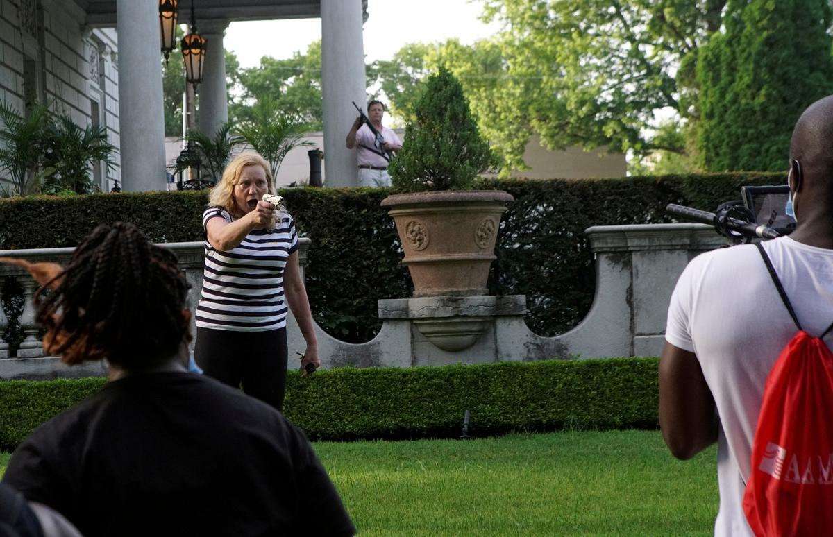 image for Police search St. Louis mansion of couple who pointed guns at protesters