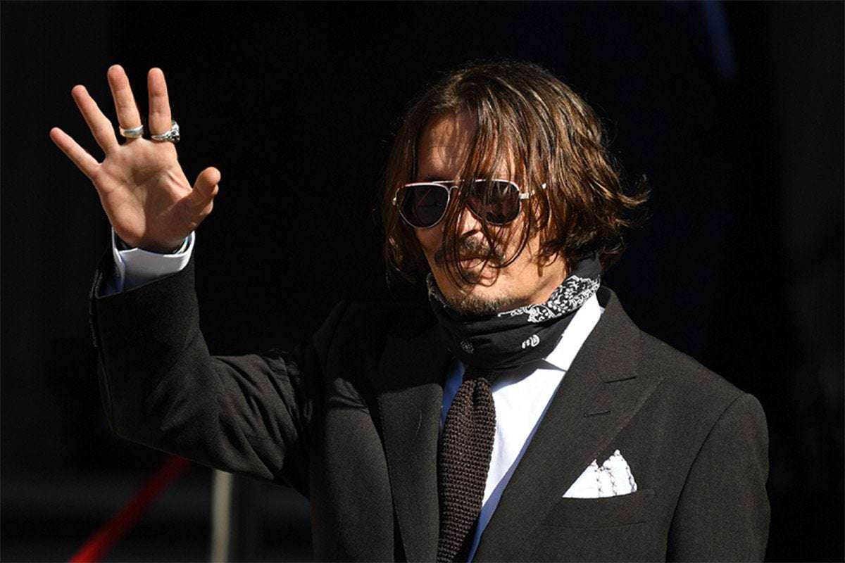 image for Johnny Depp admits calling ex-wife ‘Amber Turd’ after poop incident