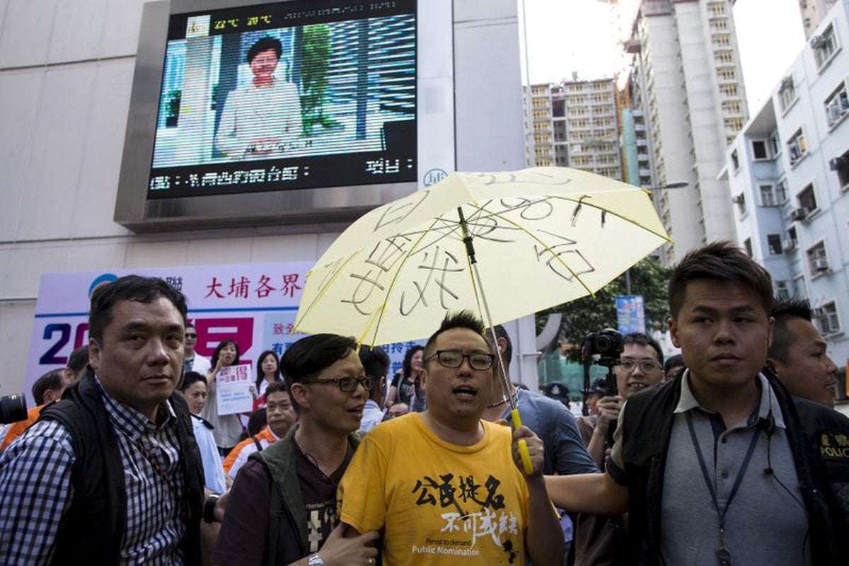 image for Hong Kong police arrest pro-democracy politician set to run for legislature
