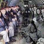 image for D-Day veterans 'sitting across' from their younger selves in the same plane which dropped them into Normandy in 1944.