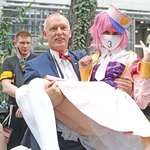 image for Here we see far-right Polish politician, Janusz Korwin-Mikke, picking up a anime femboy at a cosplay convention.