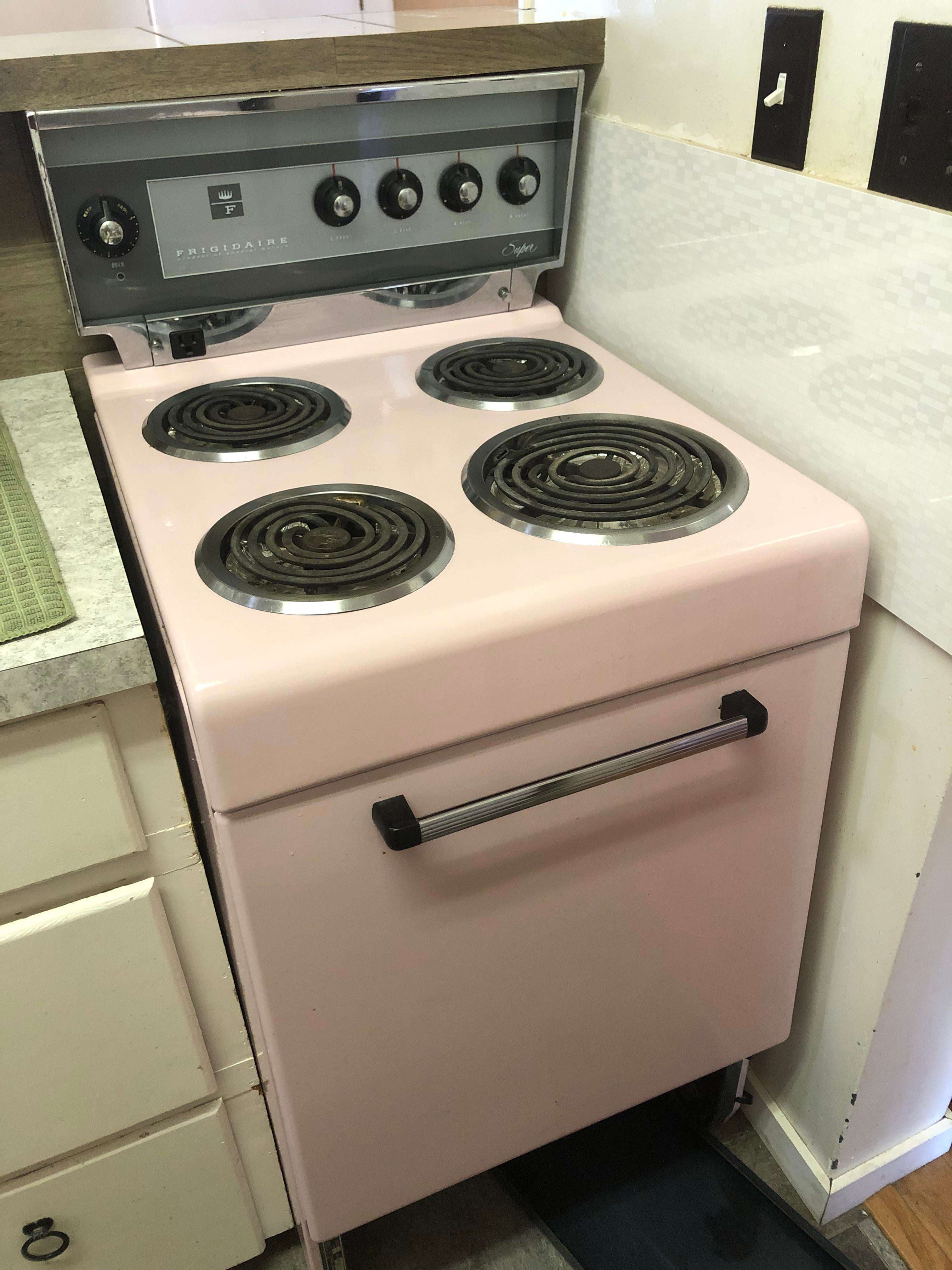image showing My dads apartment came with a baby pink stove