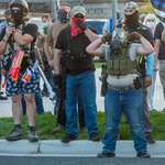 image for Man brings life jacket, nerf guns, and vacuum to a 2nd amendment protest.