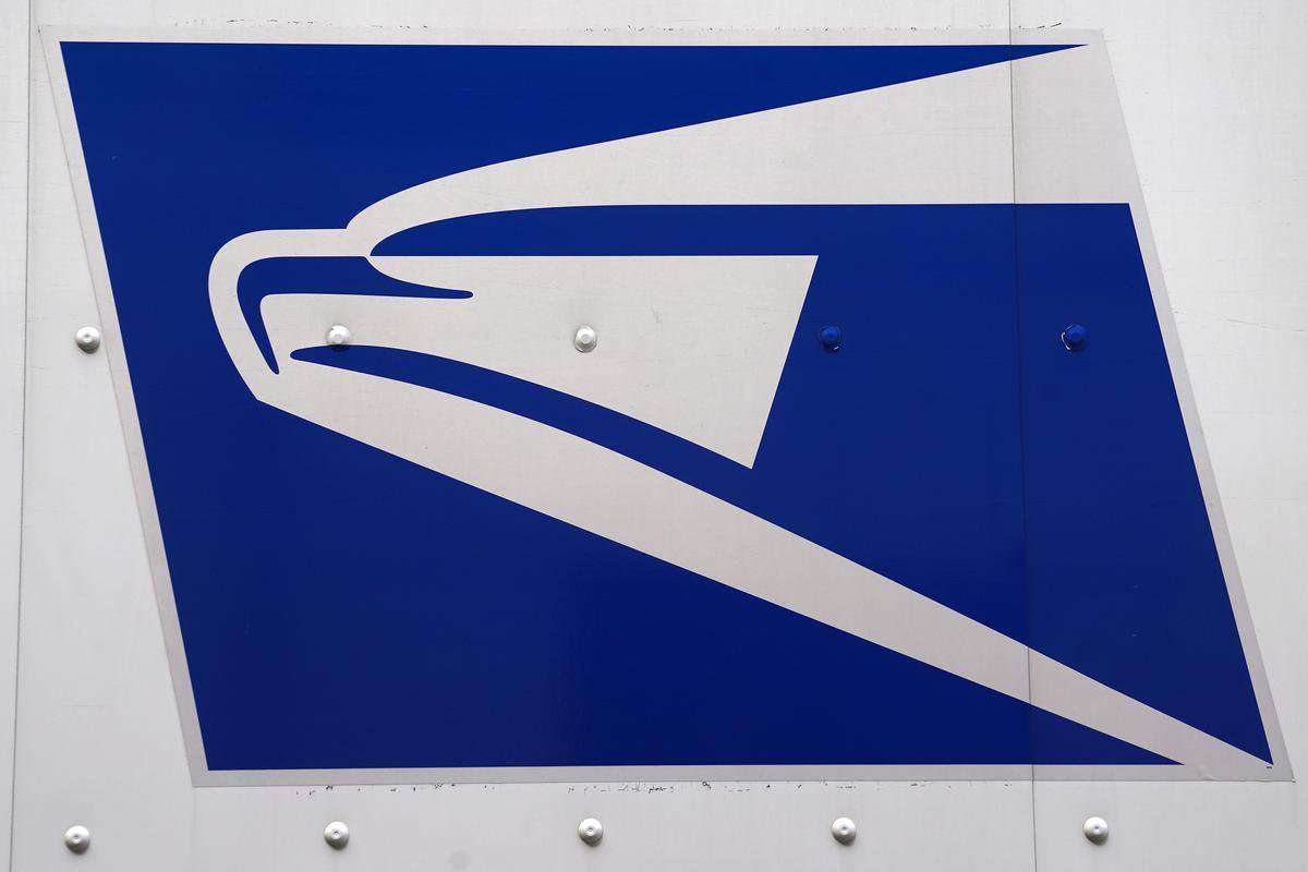 image for U.S. Postal Service chief warns of 'dire' finances, adopts manager hiring freeze