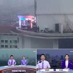 image for A Korean news program actually filming on the top of the building instead of using a green screen