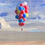 image for David Blaine casually floating over Arizona holding 52 helium balloons