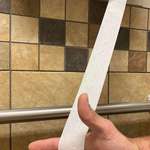 image for Gas station toilet paper about the width of an iPod shuffle.