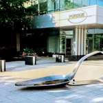 image for A Connecticut gallery owner, Fernando Alvarez, was arrested after dropping a 10-foot-long, 800-pound sculpture of a heroin spoon in front of Purdue Pharma’s headquarters and says he plans to “gift” more spoons to other drug companies, as well as to politicians and doctors.