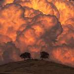 image for Towering thunder clouds that were captured during a sunset created the most amazing, yet haunting effect.