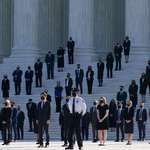 image for Ginsburg’s clerks standing on guard on the steps of the Supreme Court