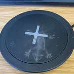 image for A lizard fell from the ceiling and left this dusty imprint on my wireless charger.
