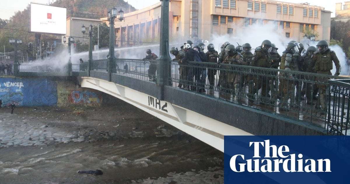 image for Chilean police throw boy, 16, off bridge during protests