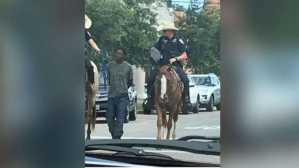 image for Black man led by mounted police while bound with a rope sues Texas city for $1 million