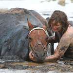 image for Woman who stayed with her horse for three hours until help arrived while the horse was stuck in mud.