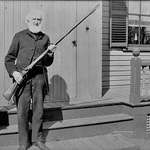 image for My Great Great Great Grandfather Amos Locke holding the musket his grandfather used to fire on the British at the Battle of Lexington in 1775