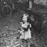 image for Young French girl showing off her cat, 1959.