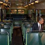 image for Barack Obama sitting in the seat Rosa Parks refused to give up on a Montgomery bus