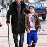 image for Nicolas Cage walking down the street with his son