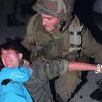 image for Fourteen year old Mohawk and future Olympic gold medalist Waneek Horn-Miller cradling her younger sister after she herself was bayoneted in the chest by a Canadian soldier. Quebec, Oka Crisis, 26 September 1990. [780 x 439]