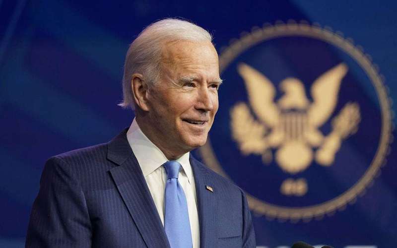 image for Biden asks Americans to 'turn the page' after Electoral College confirms win