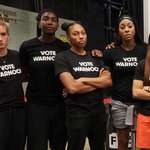 image for Kelly Loeffler's WNBA team Atlanta Dream wearing shirts promoting her opponent Raphael Warnock