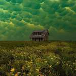image for Green mammatus clouds, which usually precede a tornado, over an abandoned house.
