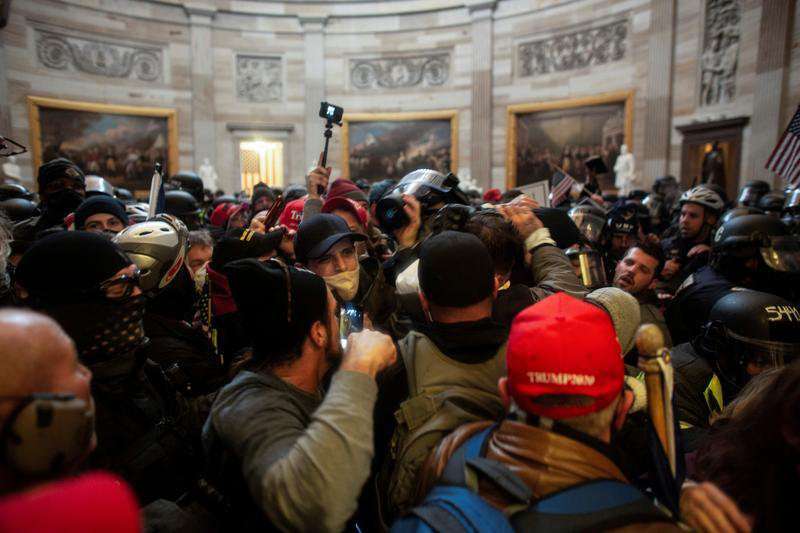 image for Some U.S. Capitol rioters fired after internet detectives identify them