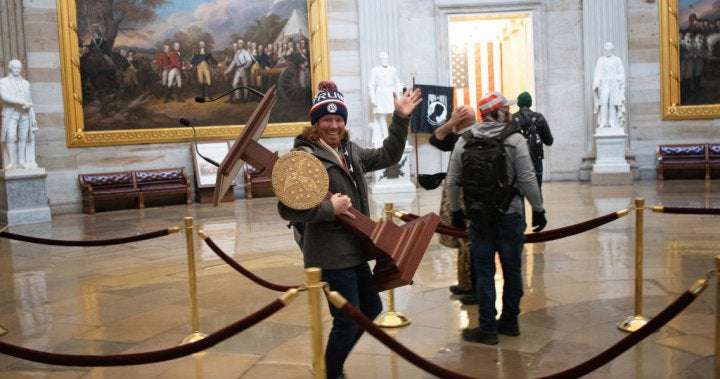 image for Florida man photographed carrying Pelosi’s lectern at U.S. Capitol protest arrested