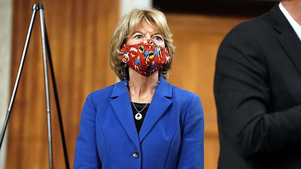 image for Murkowski says it would be 'appropriate' to bar Trump from holding office again