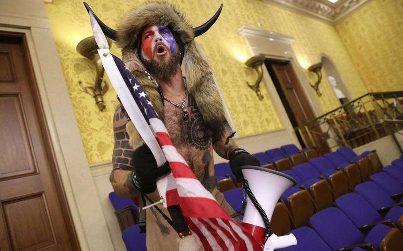image for Capitol rioter known as "QAnon Shaman" will be jailed until trial