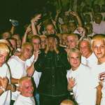 image for Dr Dre poses with Eminem lookalikes on the set of the Real Slim Shady music video.