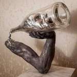 image for "First the man takes the drink, then the drink takes the man." Sculpture created based off an old Irish saying.