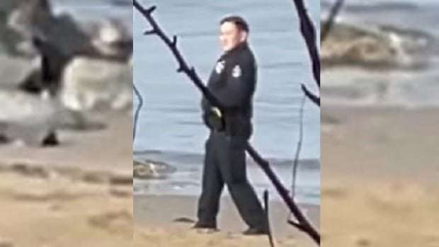 image for 2 Vancouver police officers caught on video posing with dead man on Third Beach
