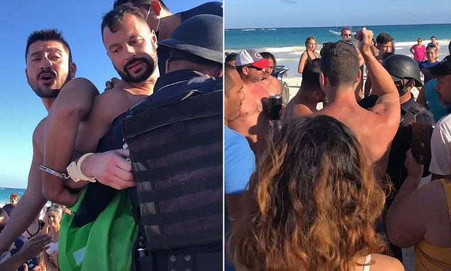 image for Canadian gay couple handcuffed by Mexican cops at a Tulum beach for kissing